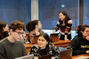 Ardina Hasanbasri speaking to students in a classroom